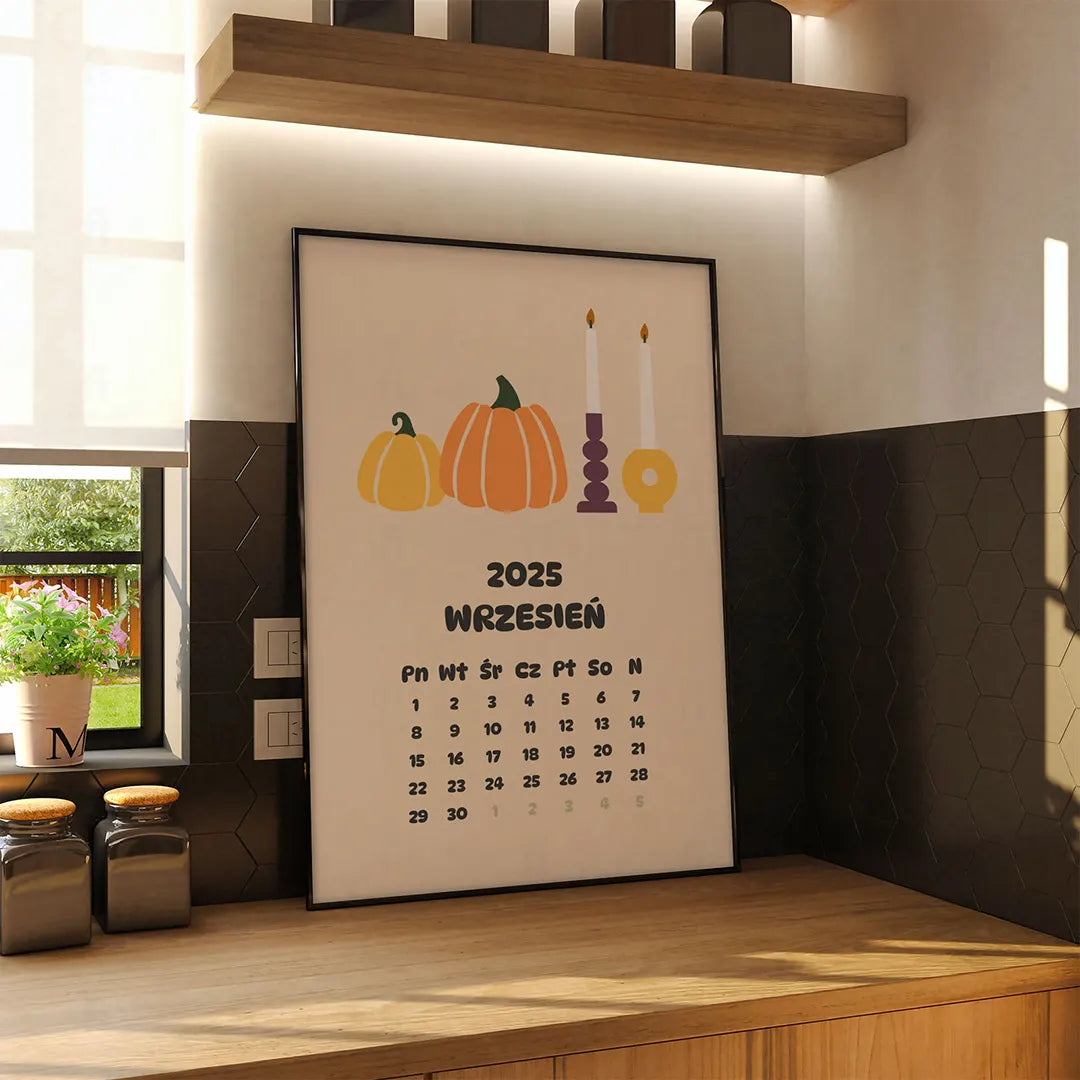 Plakat z kalendarzem na wrzesień 2025 wiszący na ścianie w kuchni
